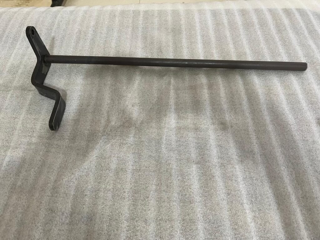 A specialized Shaft Assembly Brake Pedal Inner designed for agricultural machinery, showcasing the high-quality Precision Engineering found across our durable range of Agricultural Components.