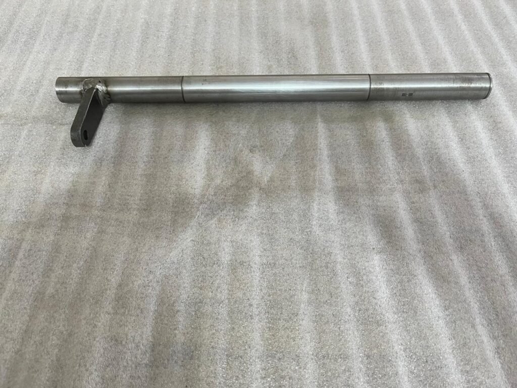 A high-durability Shaft Assembly Brake Pedal Outer, representing the quality and Precision Engineering required for reliable braking linkage in our full range of Agricultural Components